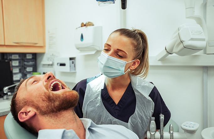 Man with female dentist