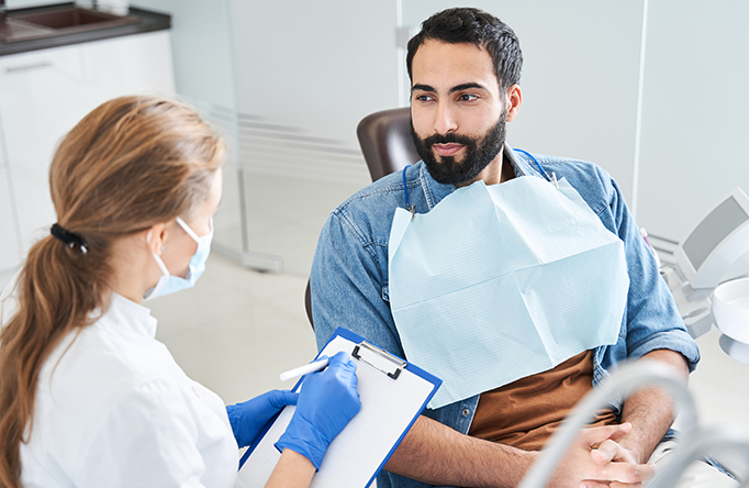 Dentist taking paper notes