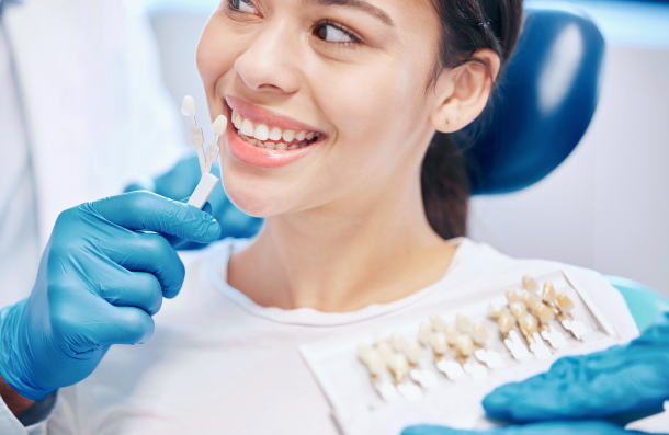Lady getting a shade match at dentist