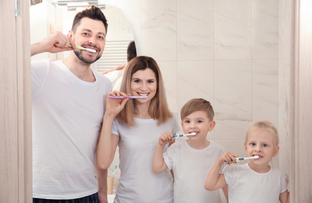 family brushing teeth