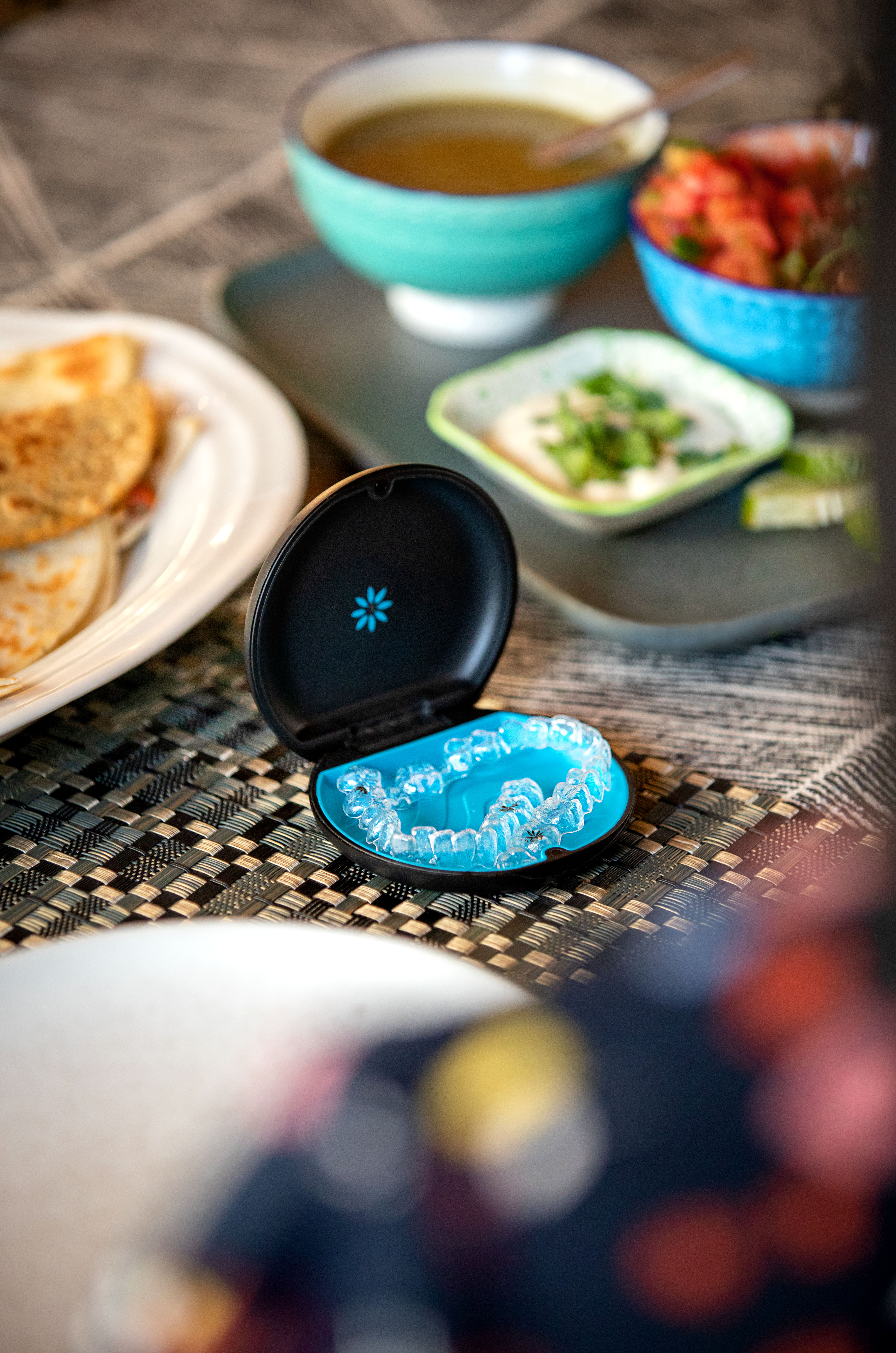 Invisalign trays on a dining table
